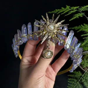 Detail view of crystal crown headband featuring purple quartz pillars and sun goddess metal motif.