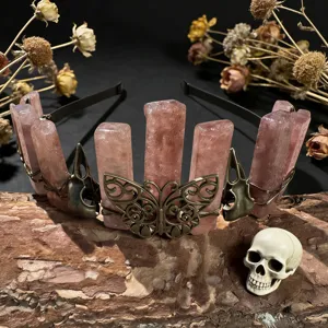 Crystal crown headband detail view featuring pink quartz columns and gothic butterfly metal accents.