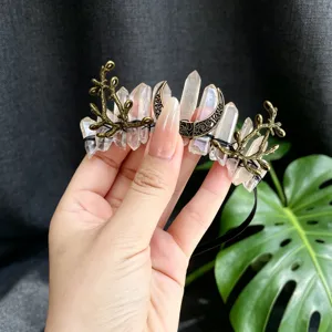 Detail shot of the crystal quartz crescent moon and branch crown headband accessory.