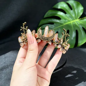 Closeup detail view of the handmade crystal moon tiara headband featuring unique branch charms.