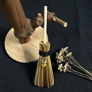 Wicca witch mini broom car hanging ornament with yellow crystal pendant and natural straw decor.