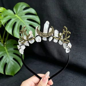 Crystal crown headband detail with natural quartz, vintage metal moon, and unique branch motifs.