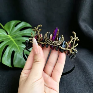 Close-up detail of gothic crystal tiara headband with black raw stones and bronze moon branches.