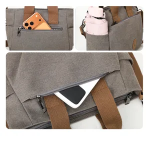 Canvas shoulder bag detail view, large capacity daily tote with multiple pockets and zipper.