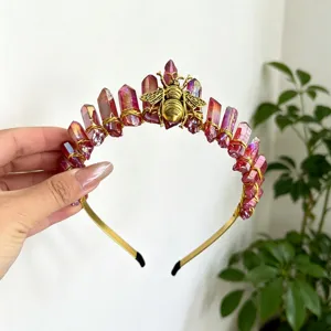 Detail shot of crystal crown headband with gold wire and bee decor for women fashion.