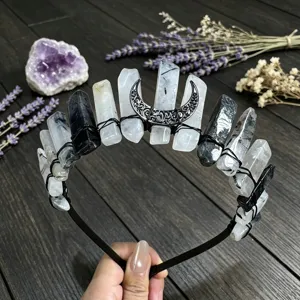 Close-up detail of natural crystal crown headband with black moon and wire wrapped stones.