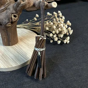 Mini witch broom detail shot, handmade wooden crystal hanging ornament for festival decor.