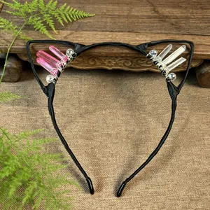 Close-up detail of handmade crystal cat ears headband with pink and clear quartz stones.