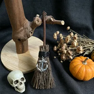 Miniature witch broom Halloween hanging ornament with metal anchor charm and decor.