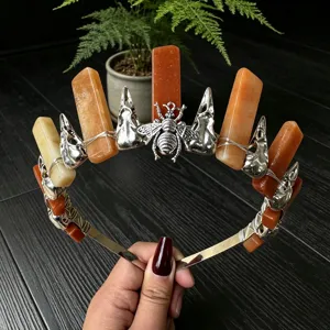 Crystal crown headband with orange crystal stones, metal bee and bird skull charms for party style.