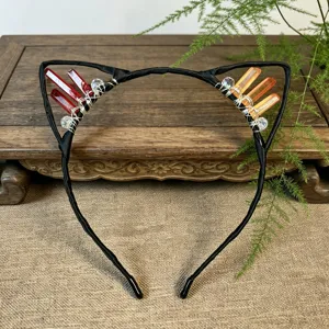 Handmade crystal cat ear headband with wire-wrapped red and orange gemstone clusters.