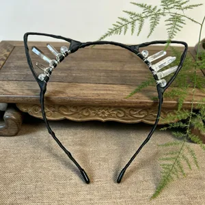Detailed view of handmade black crystal cat ear headband wire wrapped natural quartz stones.