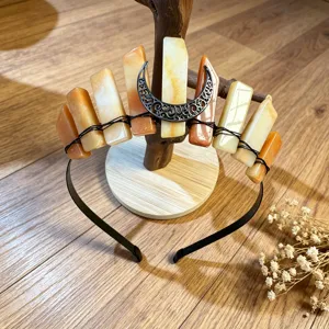 Natural crystal tiara headband with orange crystal pillars and crescent moon decor for women.