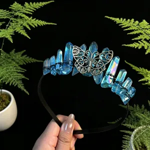 Close-up detail of blue crystal quartz crystal tiara headband featuring vintage silver butterfly.