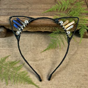 Handmade black cat ear headband detailed view with colorful crystal clusters and wire wrapping.