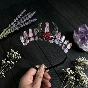 Crystal crown detail shot featuring pink aura quartz, black moon and red rose design for women.