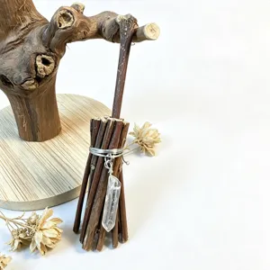 Mini twig broomstick decoration with natural clear quartz crystal pendant for home holiday decor.