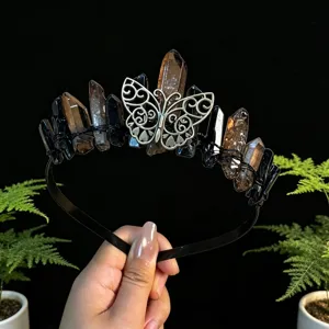 Detailed view of the natural crystal tiara headband featuring raw stones and a silver butterfly.