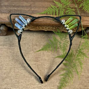 Handmade crystal cat ear headband detail, blue and green crystal clusters wire-wrapped on hoop.