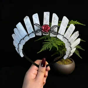 Crystal tiara headband featuring raw white crystal pillars, black metal wire, and red rose detail.
