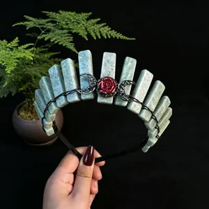 Natural crystal crown headband with green stone pillars, black crescent moons and red rose.