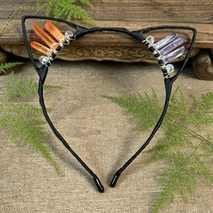 Close up detail of handmade crystal cat ears headband with raw quartz stones for women.