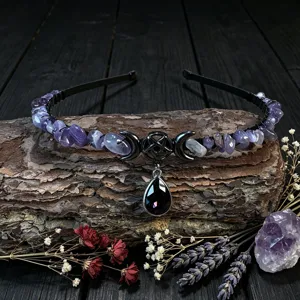 Close-up detail of gothic crystal crown headband with crescent moon and pentagram pendant.