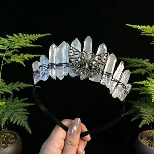 Crystal tiara detail featuring raw quartz points and an intricate bronze butterfly design.