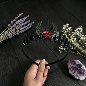 Detailed view of gothic black crystal moon flower headband, exquisite metal and rose design.