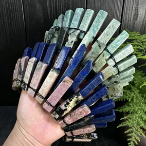 Detail view of handmade natural crystal crown headband with colorful stone pillars and wire.