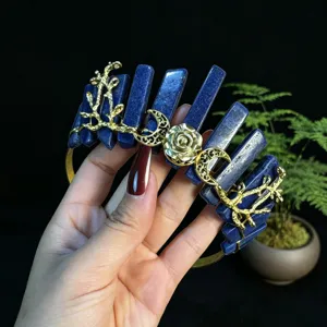 Crystal tiara detail showing blue stone pillars, gold roses, and moon branches for elegant hair.