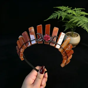 Exquisite crystal crown headband detail, featuring red stone pieces and gothic moon charms.