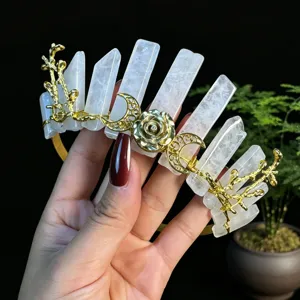 Elegant crystal tiara crown with gold metal moon rose and twig design for women party wear.