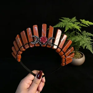 Close-up detail of the natural red crystal stone crown headband with metal moon and rose motif.