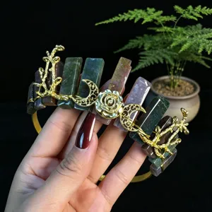 Detailed view of the crystal crown headband featuring raw stones, gold roses, and moon charms.