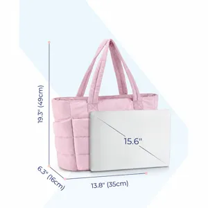 Detail view of pink quilted tote bag showing dimensions and laptop compatibility.