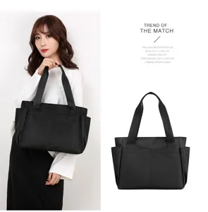 Solid color nylon shoulder bag with multi pockets, large capacity casual travel tote for women.