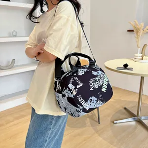 Canvas crossbody bag for women, stylish graffiti print shoulder handbag with large capacity.