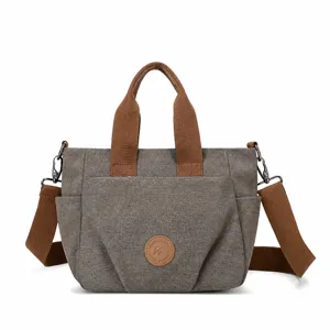 Stylish canvas shoulder bag for women, large capacity tote with top handle and strap.