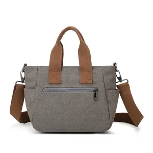 Canvas shoulder bag for women, stylish casual tote bag with top handle and crossbody strap.