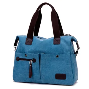 Casual canvas tote bag for women, multi-pocket large shoulder handbag with brown straps.
