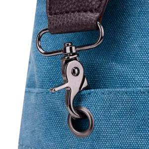 Canvas shoulder bag metal clasp detail, stylish casual retro crossbody bag hardware.