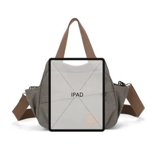 Vintage canvas messenger bag for men and women, casual crossbody bag with wide strap.