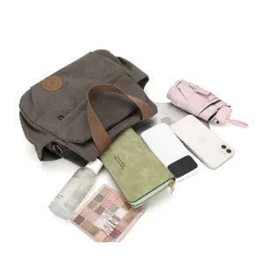 Vintage washed canvas messenger bag for men and women, casual commuter shoulder bag with long strap.