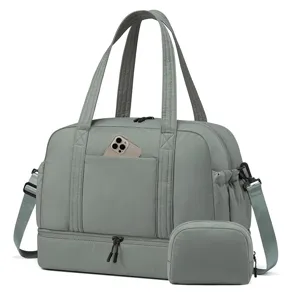 Graue Reisetasche mit Schuhfach und Kulturbeutel, perfekter Sport- und Wochenendbeutel.