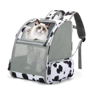 Breathable cow print pet backpack with mesh windows for portable cat travel and outdoor hiking
