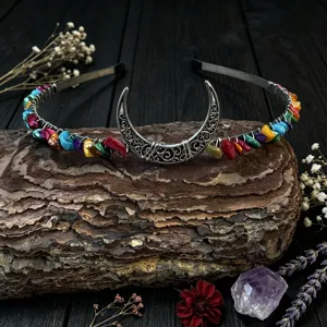 Close-up detail of the handmade crystal moon headband, featuring colorful healing stones.