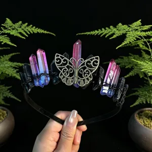 Close-up detail view of the handmade crystal crown headband featuring metallic butterfly motif.