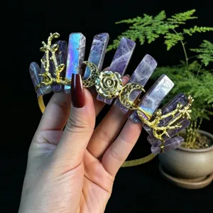 Close-up detail of handmade crystal tiara with purple quartz and gold moon rose wire wrap.