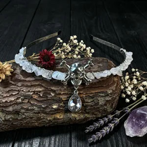 Gothic crystal skull headband detail showing handmade wire-wrapped quartz chips and teardrop pendant.